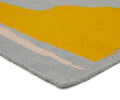 A 100% wool yarn flat weave rug from Cold Picnic. An abstract design featuring blue/grey with yellow and black