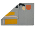 A 100% wool yarn flat weave rug from Cold Picnic. An abstract design featuring blue/grey with yellow and black